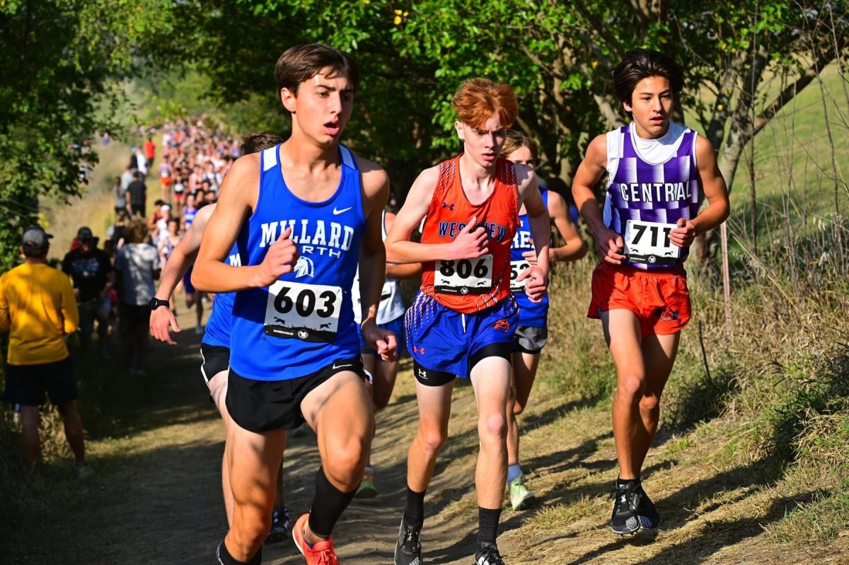 Cameron Bailey, 10, runs hard fighting for first place in the JV meet. Bailey, finished in first place for JV after he ran his fastest ever time.  