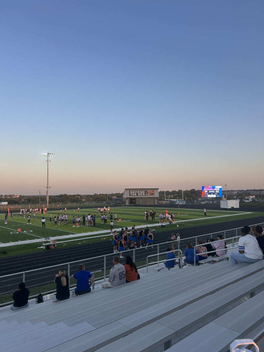 Girls on the Gridiron players chat with coaches as they head into the second half of the Junior versus Senior game. The players on both teams worked hard as football players and male members of other sports got the chance to be cheerleaders on the sidelines.  