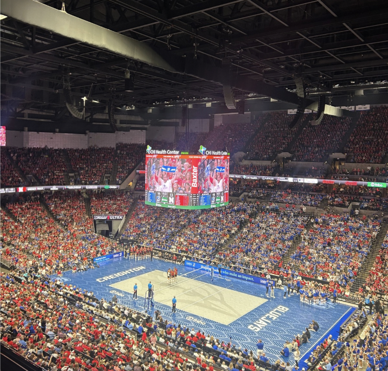Thousands of fans spectate a 5-set match at the CHI Health Center in downtown Omaha. On Tuesday, the Huskers won after a competitive match against Creighton. Photo taken by Avery Simms.