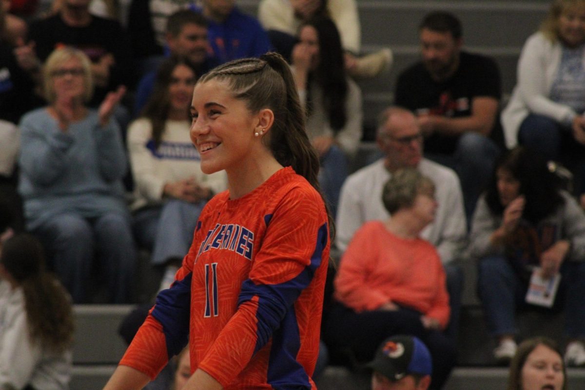 Rylee Meysenburg, 12, smiles after a point during Westview volleyball’s senior night. The game was a sweep for Westview against Omaha North. 