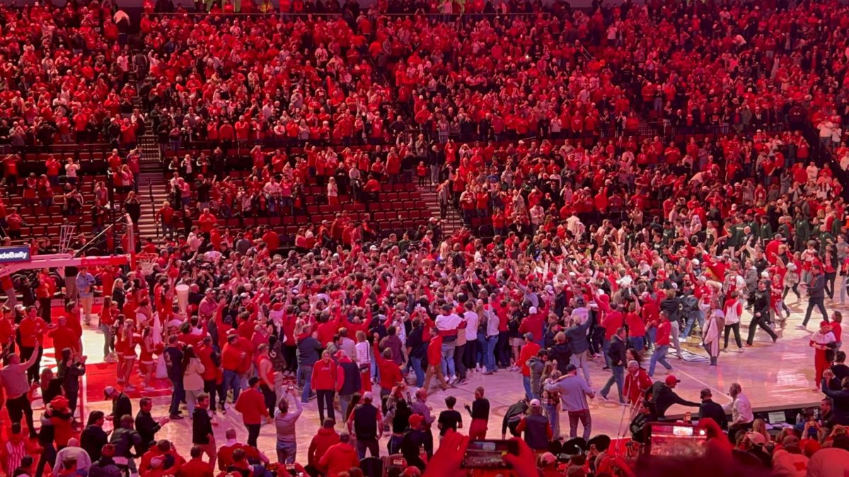 Nebraska fans storm the court after their upset victory over No.9 Michigan St. No.13 Nebraska won 58-56 over the Spartans to move to 14-0 and prove that they are a legit title contender. Photo taken by Mason Burg